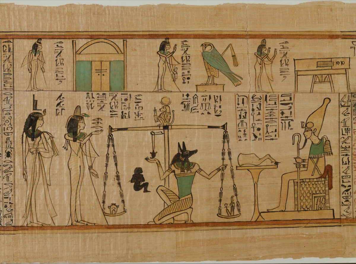 Nauny’s funerary papyrus shows Isis behind Nauny on the left and Anubis kneeling at balanced scales. Thoth appears as a baboon above the scales; Osiris sits on the right. Further scenes and hieroglyphs appear in the upper register.